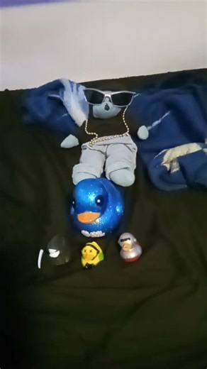 T Showing off his rubber ducky collection
