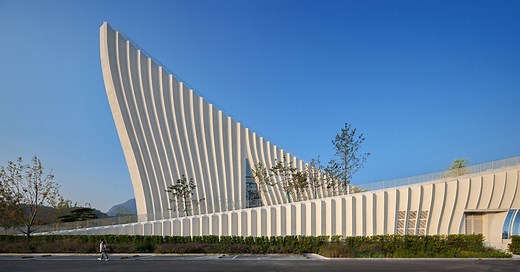curved concrete roofs root atelier alter architects' museum into chinese mountain foothills