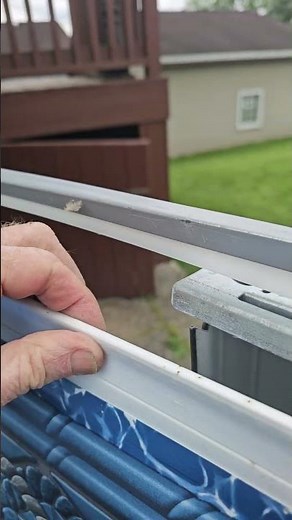 Foolish installer put overlap strips over a J-hook liner