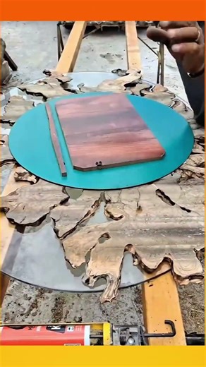 Smoothing and leveling a tree root, transforming it into a unique and beautiful frame for a mirror.