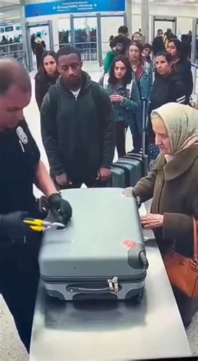 During a routine airport baggage check, a security officer noticed something unusual in an elderly woman’s suitcase. When he insisted on opening it, the grandmother nervously protested, claiming it only held gifts for her grandchildren. But as the suitcase was unlocked, everyone froze, shocked by what was inside. (Check In First comment👇) | Honor Guard
