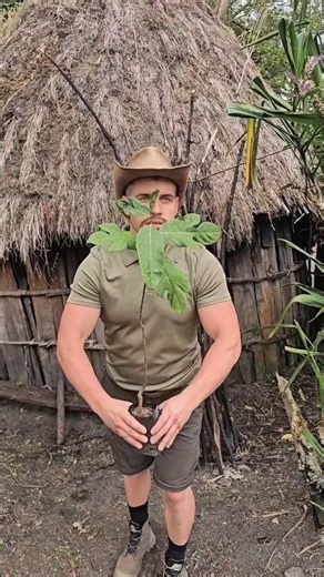 A Brazilian man brings a grinding stone to a child