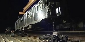Here's how subway cars get loaded onto the tracks
