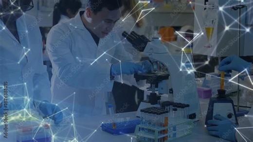 lab tech handing sample vial to researcher starting microscope focusing while analyzing sample