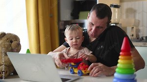 Father child communicate share joy at computer. Children's laughter fills room. Work and play blend seamlessly for father and child. Father and child appreciate moments spent together at work and play Stock Video