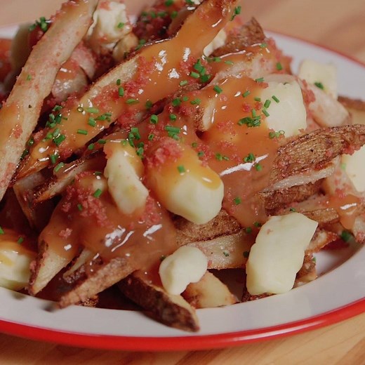 We made ketchup chip poutine and it's the most Canadian thing we've ever done. Recipe: http://bit.ly/2IzNWRw | CBC Life