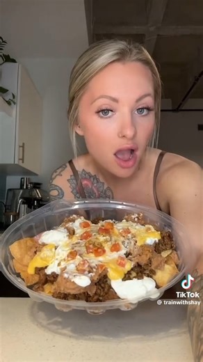 15K views · 519 reactions | This macro friendly Taco Bell nachos bell grande slapppzzzz  My cookbook is out now! Head to www.trainwithshay.com/cookbook to learn about everything that's included!  For online fitness/nutrition coaching info, head to www.trainwithshay.com/programs  #lowcalorietacobell #lowcaloriefastfood #macrofriendlymeal #lowcaloriemeal #highproteinmealideas | Train with Shay | Facebook