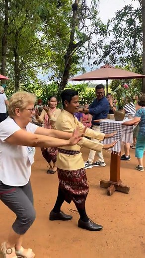 Foreign visitors joyfully dance to traditional Khmer music, surrounded by the serene beauty of ancient village rice fields. 🌾✨🕺💃 #CharmingCambodia #siemreap #lifestyle #vibes #peopledailycambodia #FYI #Cambodia #welcome #Amazing #kingdomofsmiles | People’s Daily-Cambodia