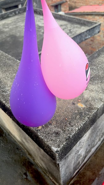 Experiment: Will a water balloon explode if it rolls down from a tall building? 💥🎈 #balloon