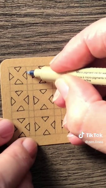 Day 7 of #the100dayproject ❣️✨ (You can find slower/longer form of all videos from this project on my YouTube channel) • Supplies: small paper tile, Micron PN pen, Faber-Castell’s Pitt Graphite Matt, General’s Charcoal White, white Gelly Roll by Sakura, and blending stumps. • #zentangle #DIY #zentangleart #czt #cztiktok #fyp #drawing #arttiktok #artistsoftiktok #artist #art #arttok