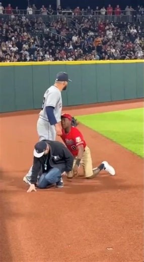 Two Fans Fall… Then One Gets Pushed Back Down