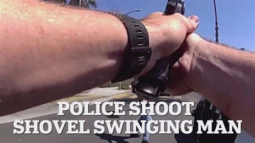 Shocking moment police shoot shovel-wielding man outside school