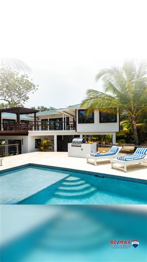 Exclusive 1-acre beachfront estate in Placencia’s elite Wild Orchid community “The Slow Loris” blends luxury, privacy, and income potential on 164 feet of pristine beachfront. Recently remodeled, this 5-bed, 4-bath home features open-concept living, three decks (including rooftop with panoramic sea-to-mountain views), an infinity pool, and a two-bedroom guest casita. Fully furnished and operating as a high-performing short-term rental with 90–95% peak occupancy, it’s a proven income generator an