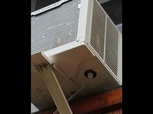 How to divert exterior water dripping from a window AC unit duct away from the home's structure