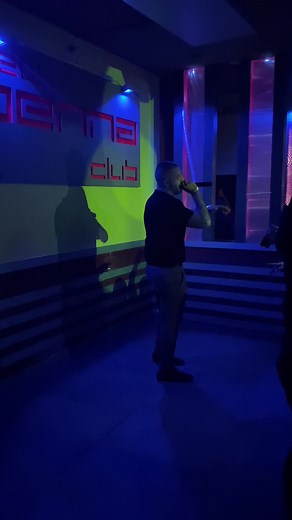 Engaging Club Performance by Male Artist on Stage