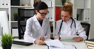 doctors comparing data in documents.