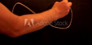 man draws an infinity sign