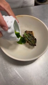 Grilled Striped Bass 🐟 Prepared with pil-pil sauce, parsley oil and grilled kale leaf #chef #restaurant #dining #foodart #cooking | ChefSajal GhuGhu