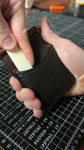 Breaking in leather wallet pockets with a bone folder #leathershorts #asmr #leathercraft #handmade