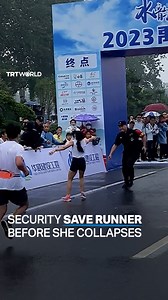 A collapsing marathon runner was saved by quick-thinking security staff before she fell to the ground just in front of the finish line of a race in Dezhou, China, on September 25. The woman lost consciousness, but was allowed to leave after resting as she showed no signs of complications. | TRT World