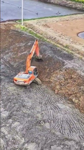 Excavator Digging a Fish Pond