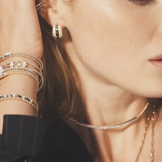 Explore Gabriel & Co's iconic Bujukan collection: featuring arcs of gold spheres, radiant mini-cluster diamonds, and chains of perfect gold circles. | Gabriel & Co.