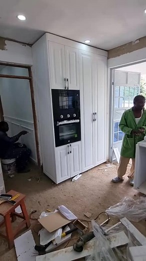 Kitchen Renovation Process: Installing White Cabinets