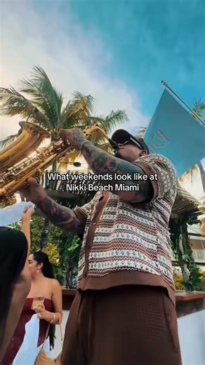 5.2K views | Shoes off, toes in the sand, and a giant sushi boat afloat in front of you and your besties is the only way to go at this beach club. With swaying palms, daybeds and cabanas, and dining tables and chaises throughout, the people watching is almost as captivating as the food and the vibe. | Nikki Beach Miami | Facebook