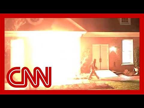 Newly released video shows man setting fire to governor's residence