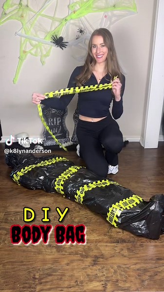 DIY BODY BAG🫣⚠️☠️🪦 This was so realistic that it gave me the creeps making it lol. A must try for a Halloween party! IN BIO: 👩🏼‍🍳‘Cozy Comfort Meals’ recipe ebook 🗞️’Savor n’ Season’ weekly newsletter SUPPLIES: -Head: 1 gallon jug -Body: 8 2 liter bottles and 4 1.25 liter bottles -Feet: 2 tall water bottles -Duck tape -3 black trash bags -Scotch tape -Caution tape DIRECTIONS: *Make sure your are starting in the area where you want to keep the body bag so you don’t have to move it! It’s eas