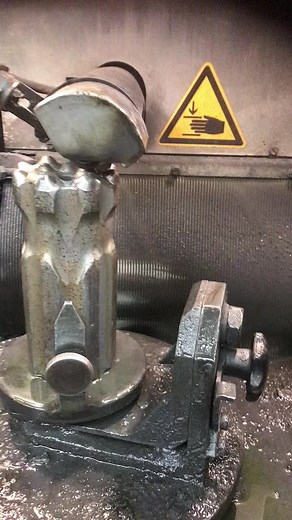 Metalworking Process: Shaping Steel Cylinder in Workshop