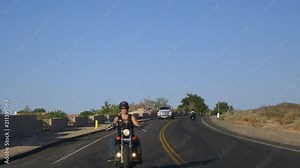 Woman on Motorcycle with dog