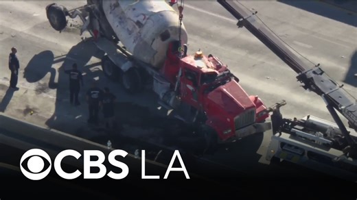 Overturned cement trunk dangling off Boyle Heights freeway transition causes hours-long closure