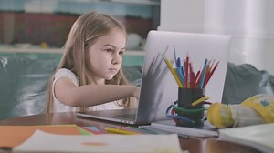 Little girl studying on a computer - Free Stock Video