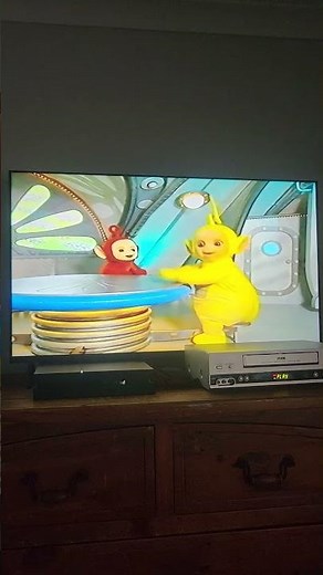 Teletubbies Go Dipsy Laa Laa And Po Stand Up And Sit Down On The Table
