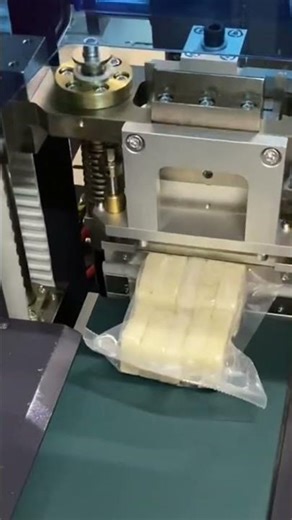 This is the process of packaging a bread using an advanced machine quickly and neatly
