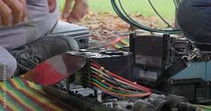 Fusion of Fiber Optics Cable Internet signal splicing and wire connection using equipment, optical line welding machine Optic fiber soldering ISP engineer