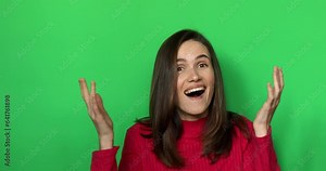 Surprised girl face. Close up of shocked woman face expression. Wow woman emotion on green background. Amazed model face. Shock girl face expression. Woman wear pink sweater.