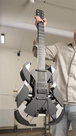 Ukulele that transforms into a guitar mid performance