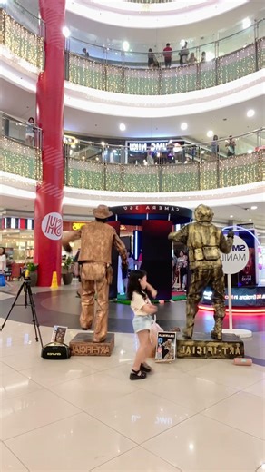 Two Statues… One Adorable Dancer 🗿✨