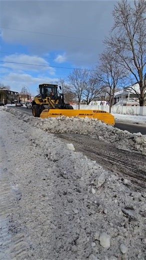Wheel Loader Plowing Street Snow