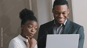 Focused male mentor manager instruct female trainee consult client explain computer project, professional executive teaching new worker intern learning new skill using laptop in office, internship