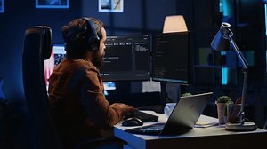 clip-3459320379-programmer-does-multitasking-finish-developing-pc-code