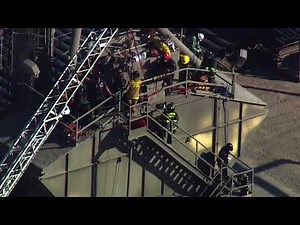 Crews work to rescue man stuck in cement mixer