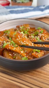 Rice Paper Tteokbokki (Rice Cakes): Easy rice cakes made with rice paper! Chewy, bouncy and smothered in a spicy gochujang sauce. Comment ‘recipe’ for full recipe! #ricepaper #easyrecipe | Herman at Home