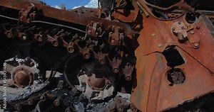 Close-up detailed tracking shot - caterpillar track of a burnt-out Russian tank t 72. Exibition in Kyiv on Sophia Square Military vehicle destroyed by the explosion of Ukrainian artillery shelling