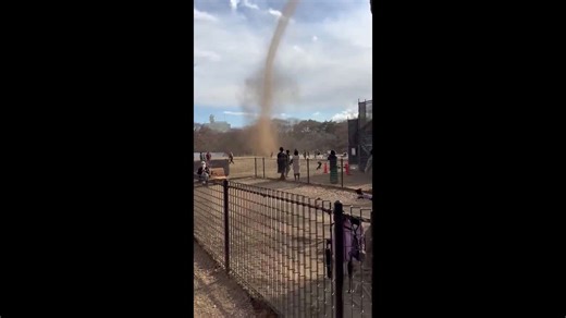 Dust devil tornado whips up dirt as parkgoers flee in Japan