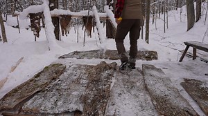 My wife helped me trim branches and cut trees to clear a spot for our new off-grid log cabin overlooking a stream and beaver meadow in the wilderness. In the off-grid workshop, I added ash bark and live edge aspen boards to the front gable and frame the front door. Full Video: https://www.youtube.com/watch?v=qvQt18Ha6Q4 | My Self Reliance