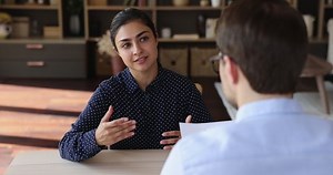 clip-1081628438-job-interview-young-indian-female-seeker-sit