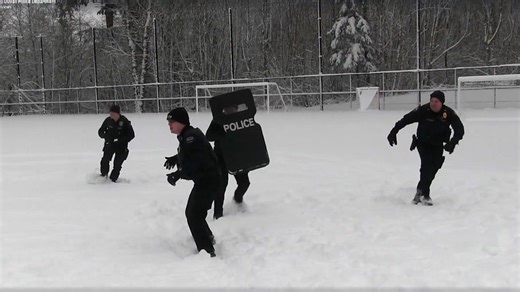 WATCH: Police get in snowball fight with kids during snowstorm